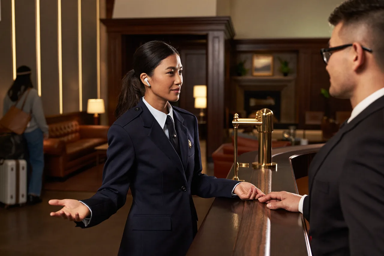 Security officer in the lobby of a Worcester hotel in the evening