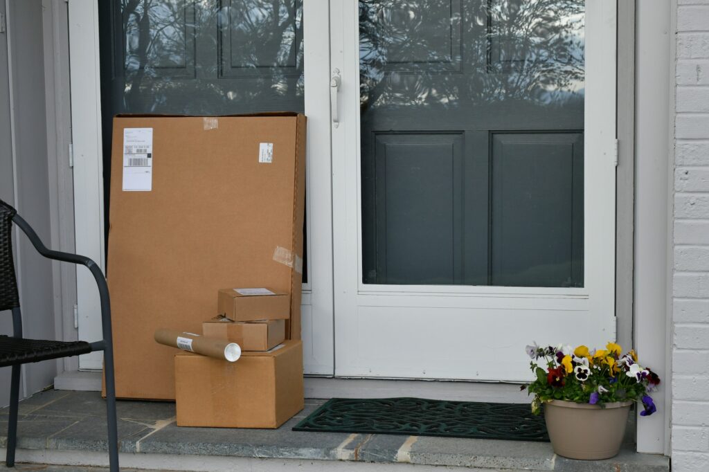 Boxes Packages online orders on a front porch after being delivered
